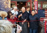 Lemoore restauranteur Sunny Law cuts the ribbon at his downtown San Luis Obispo 201 Kitchen SLO.